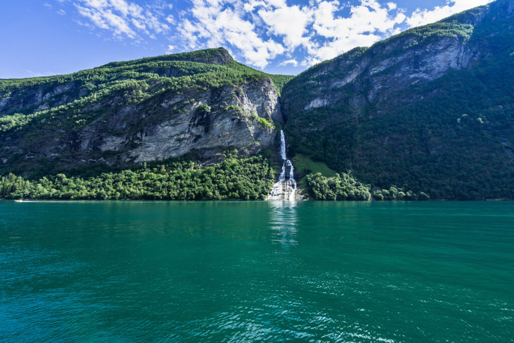 The Suitor (or Friar) Waterfall over Geirangerfjord viewed from a sightseeing boat in the summer, Sunnmore, More og Romsdal, Norway