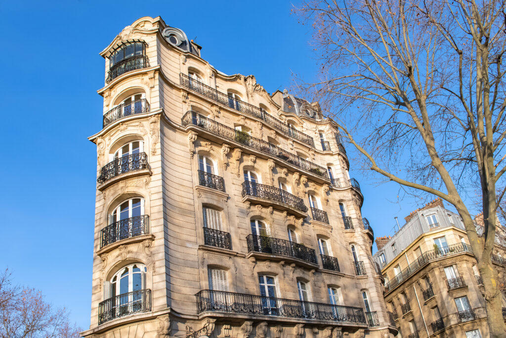 Paris, typical facade and windows, beautiful building boulevard du Montparnasse