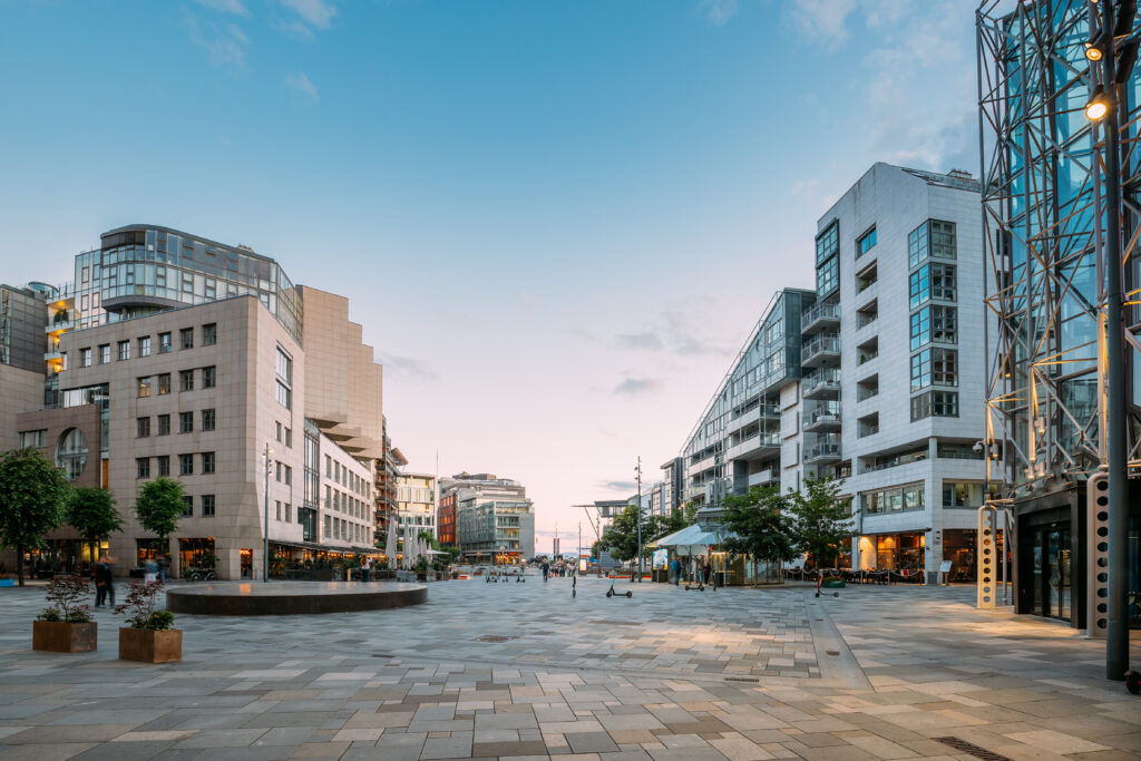 Oslo, Norway. Residential multi-story houses In Aker Brygge District In summer evening.