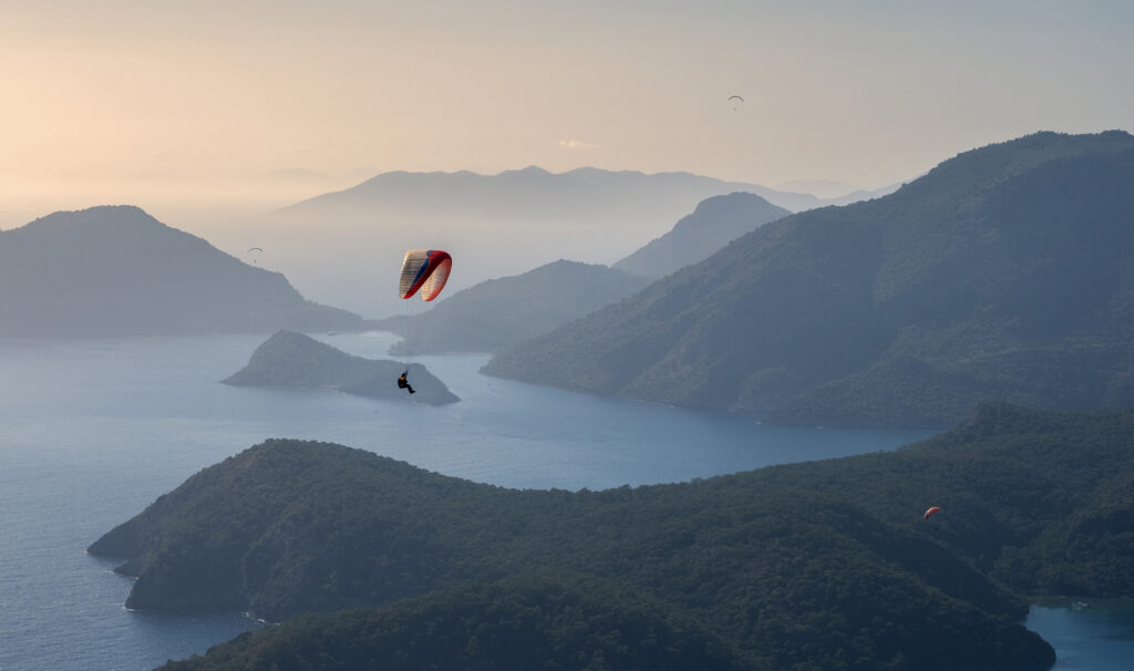 Paragliding over the Blue Lagoon Oludeniz over the sea and mountains in turkey