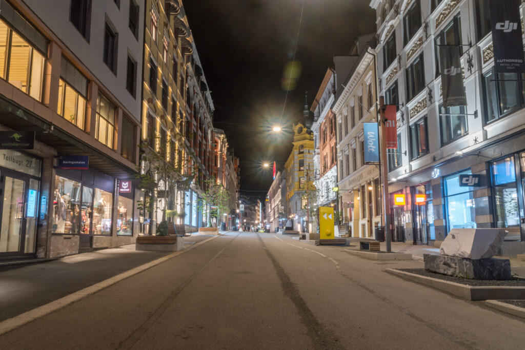 Oslo, Norway - September 24, 2021: Shopping street in city center of Oslo at night.