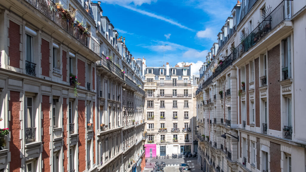 Paris, typical street, beautiful buildings in Montmartre, France