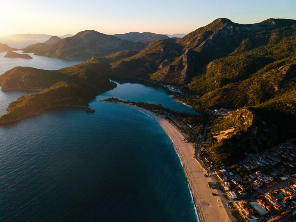 Stunning beach getaway. A serene aerial snapshot of a beautiful paradise beach at sunset. Fethiye, Oludeniz Beach.