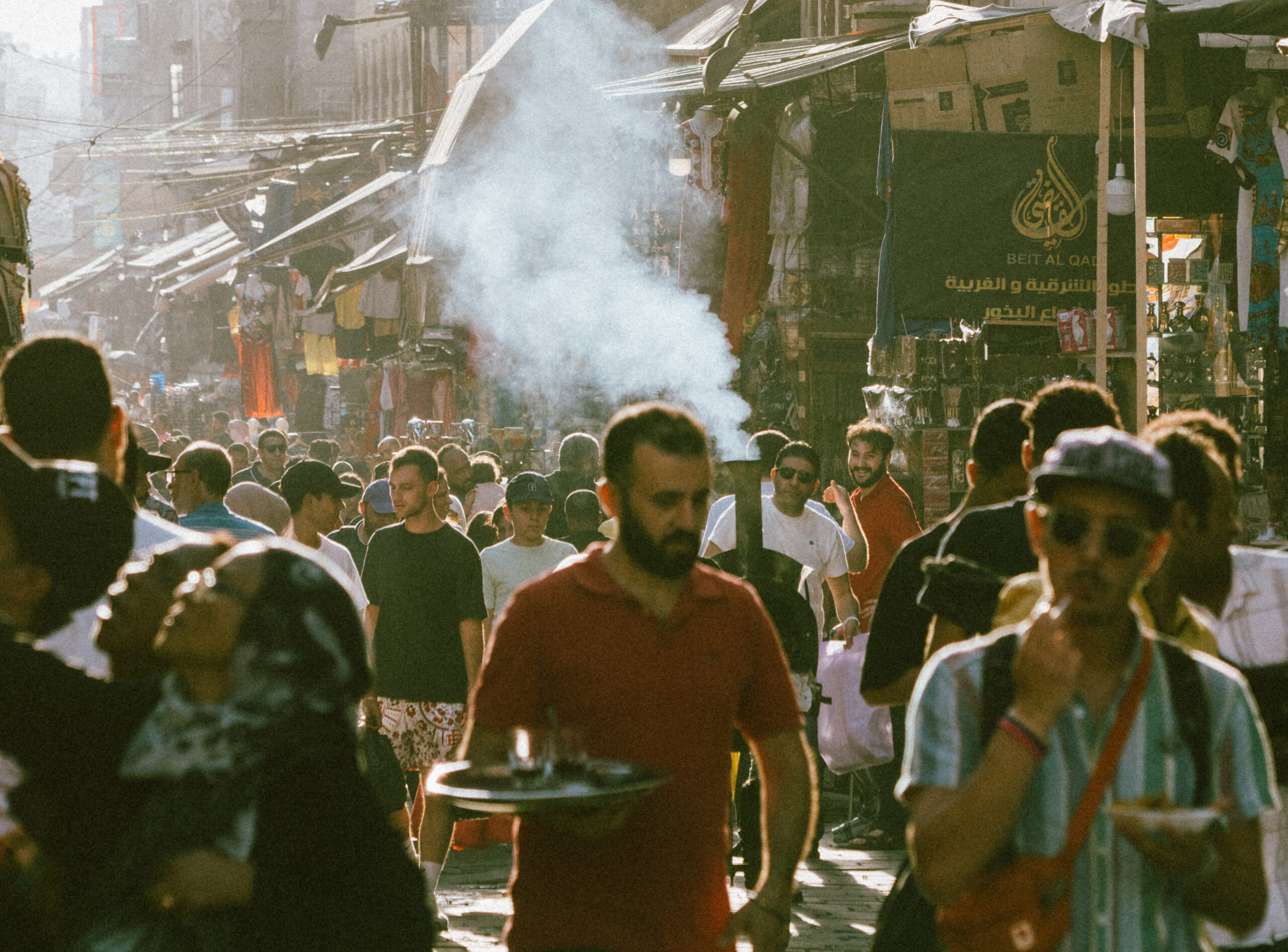 07/14/2023, Cairo, Egypt: Tourists and locals are shopping at Khan al-khalili market in Cairo. Khan al-khalili is the most famous and largest market in Arabia. Traditional mosque and church can be seen in the background.