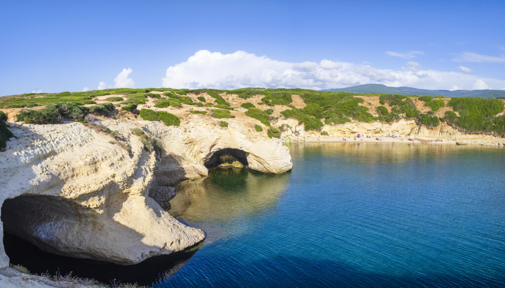 Limestone rock and clear waters at S'Archittu, a very popular tourist attraction in western Sardinia (5 shots stitched)