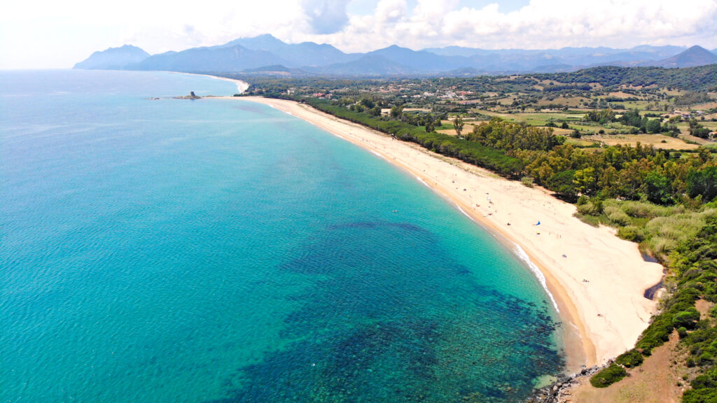 Beach of the Bari Sardo and Sa Marina  with tower, Sardegna, Italy