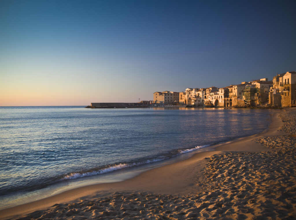 Beach and old town of Cefalu in the light of sunset