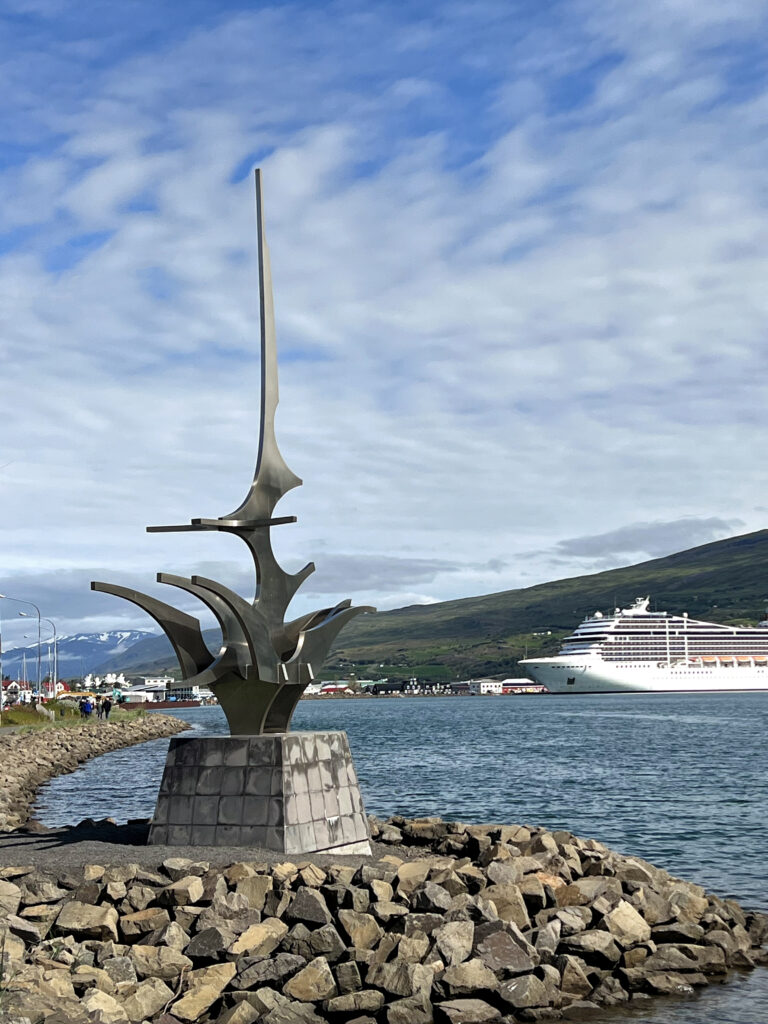 July 19, 2023 - Akureyri, Iceland.  Visitors to the city explore the harbor area of the city.