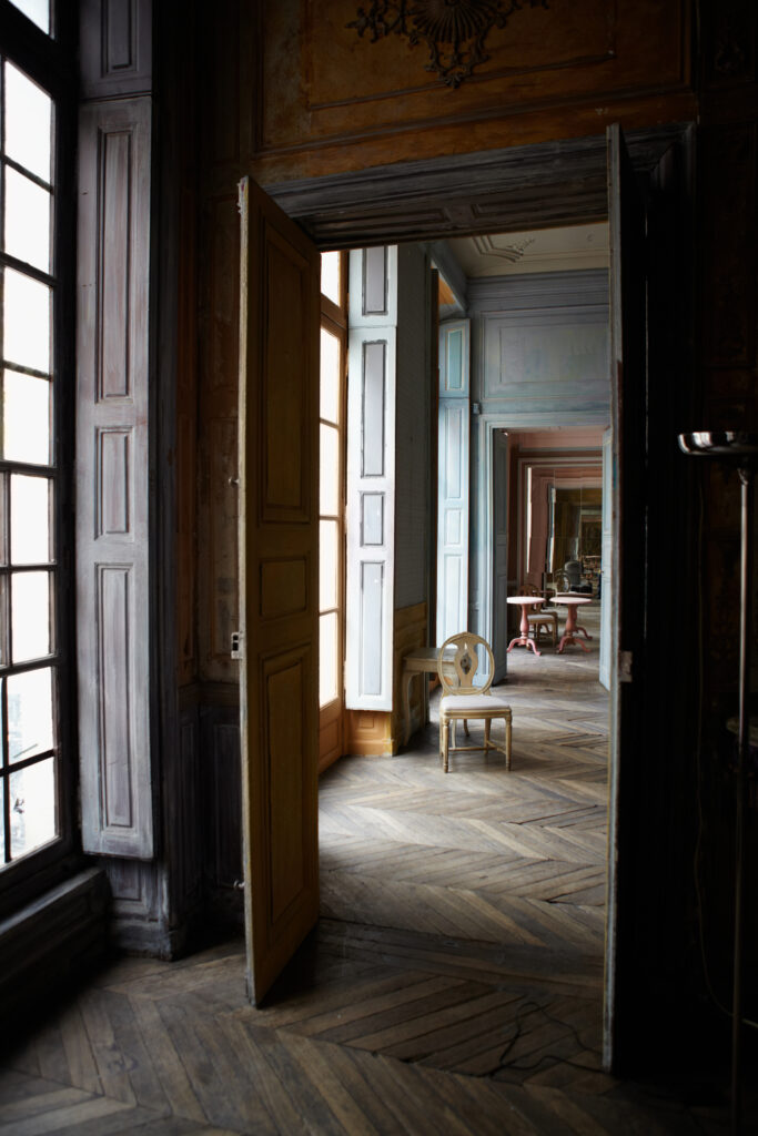 Beautiful old interior of Parisian stately building with high ceilings and large windows