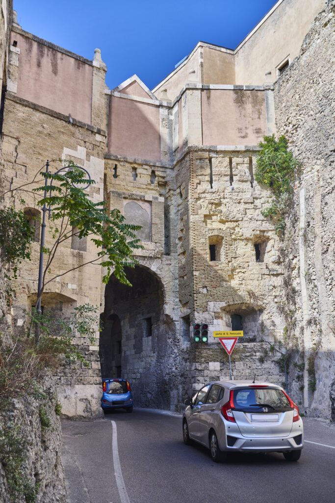 Cagliari, Italy - September 29, 2023: cars driving trough the St. Pancrazio Gate.