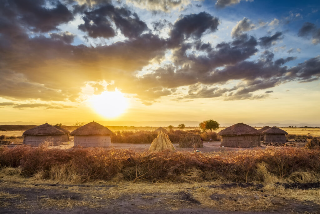 View of Maasai village with huts and enkang barrier nearby Tarangire National Park - Tanzania.