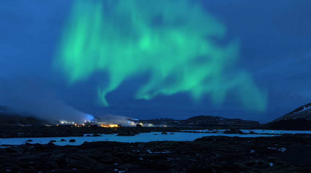 Northern lights over the Blue Lagoon, Iceland. The lagoon is fed by the water output of the nearby geothermal power plant Svartsengi. The waters are rich in minerals and combined with the natural algae give it the distinctive color and is reputed to help some people suffering from skin ailments.