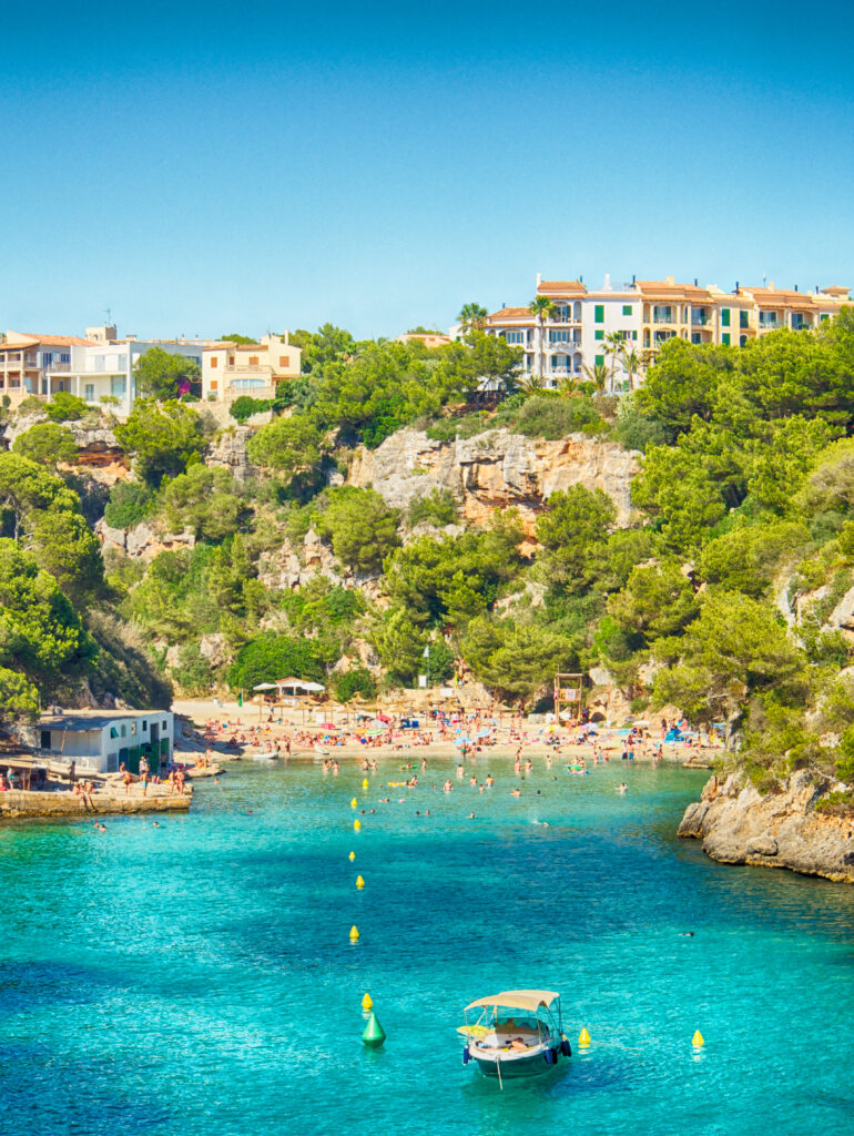 In this photo you can see the blue sea of Majorca with some recreative boats.