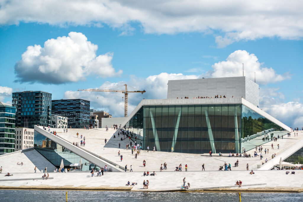 Tourists exploring Oslo Opera House, Norway, July 19, 2015 