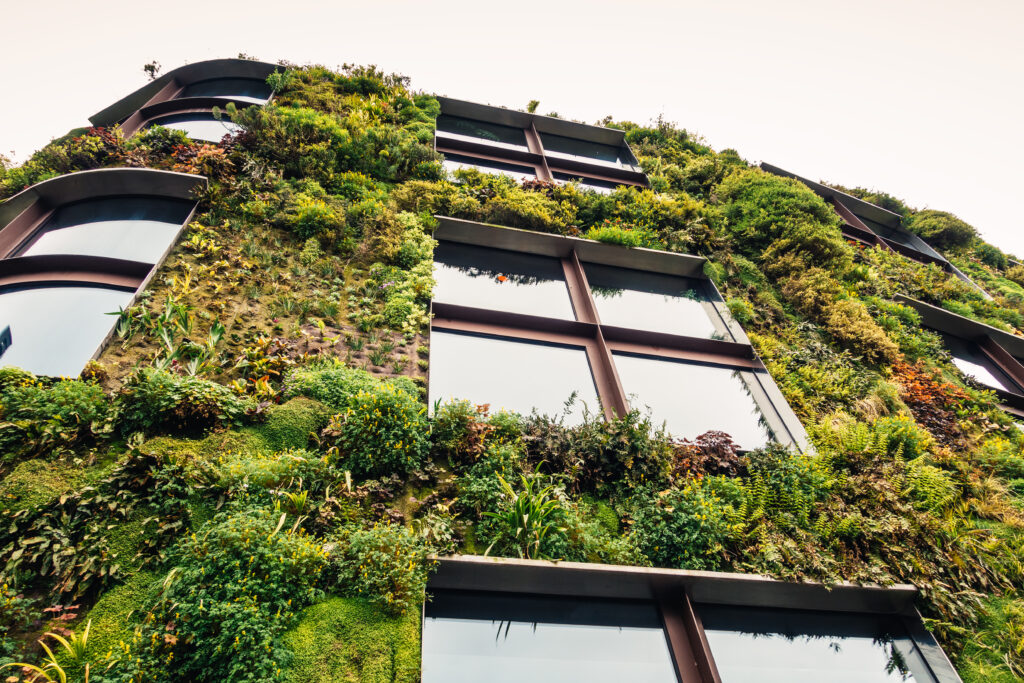 Paris, France - April 26, 2016: Close-up of sustainable building in Paris with green facade made of living plants.