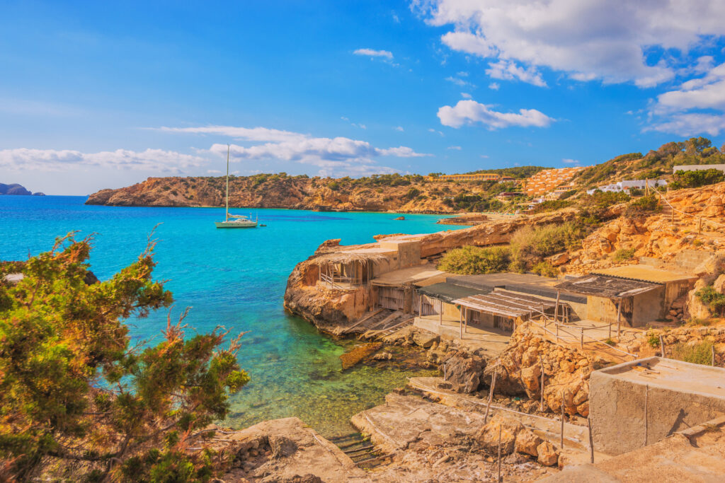 Fishing huts and bay of Cala Tarida on Ibiza