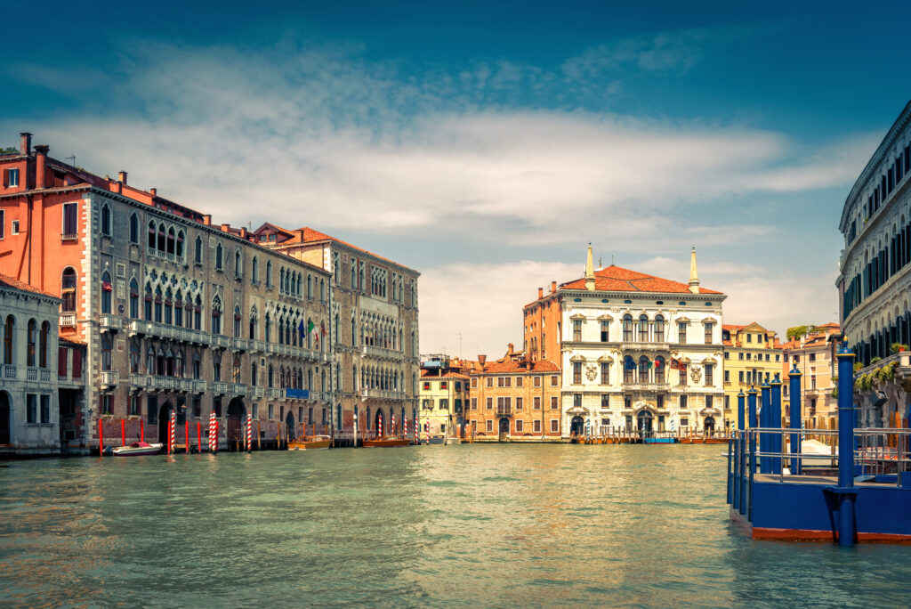 Traditional view of Grand Canal in Venice, Italy. Cityscape and landscape of Venice. Residential houses on the water. Panorama of the street in the water.