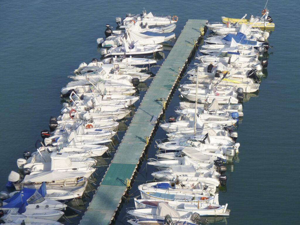 Speed boats and yachts at the pier of Ancona harbor in Italy