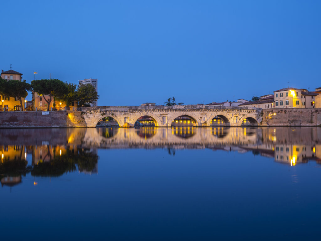 The Bridge of Tiberius (Ponte di Tiberio) or Bridge of Augustus (Pons Augustus) - a Roman bridge in Rimini, Italy in the evening.