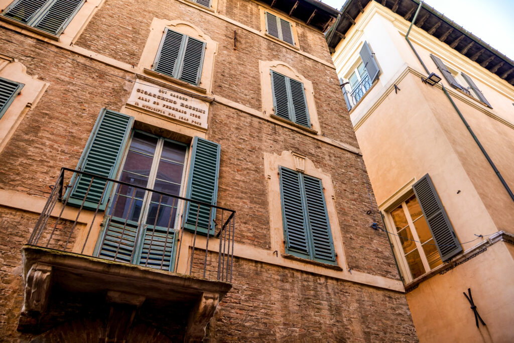 The facade of the birthplace house of the opera composer Gioachino Rossini in the historic heart of Pesaro, a town on the Adriatic coast of Italy in the Marche region. Gioachino Antonio Rossini (1792-1868) lived in this house until the age of 10 and then moved to various cities following his family. Rossini, loved and recognized among the greatest opera composers in the world, is the author of masterpieces such as The Barber of Seville, Guillaume Tell and La Gazza Ladra. Known as the City of Music and the City of the Bicycle, Pesaro was founded by the Piceni people during the Iron Age, to develop as an important center on the Adriatic Sea under the rule of Ancient Rome and later in the Middle Ages.