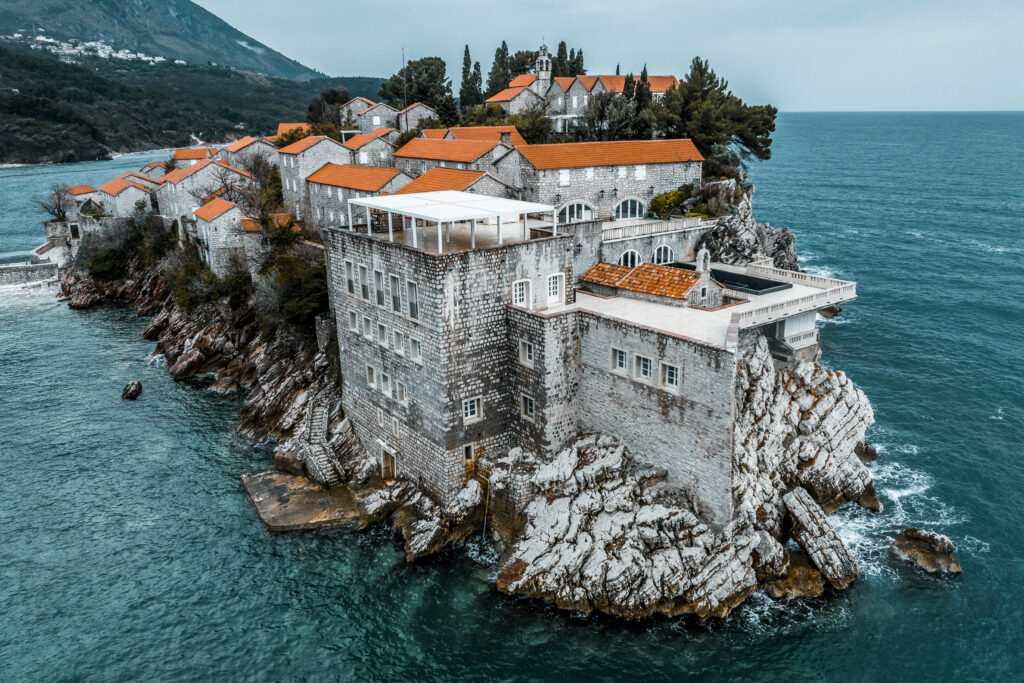 Beautiful and unique Sveti Stefan island captured with a drone during one cloudy spring day.