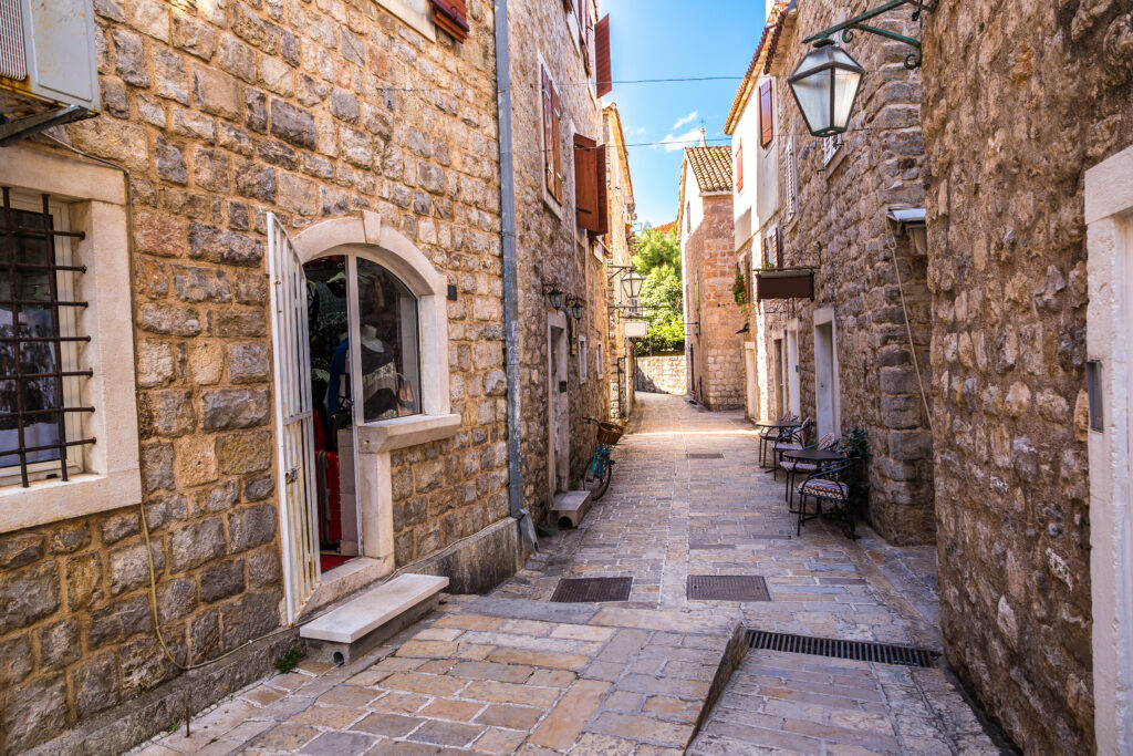 Narrow street in old town in Budva in a beautiful summer day