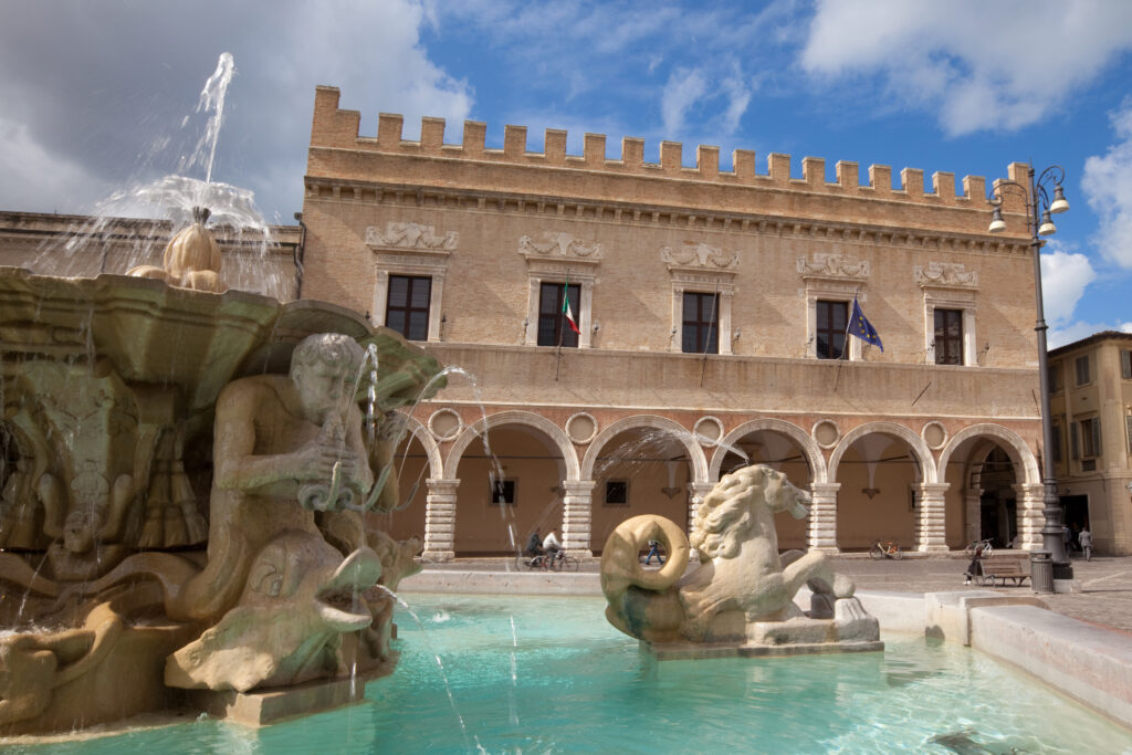 Fountain and Renaissance palace in Pesaro, Marches, Italy.